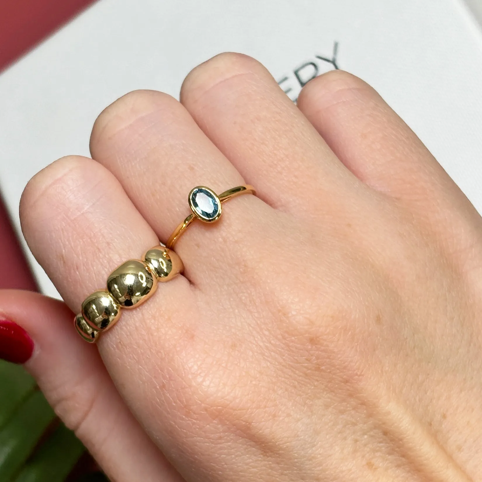 Oval Blue Topaz Bezel Ring